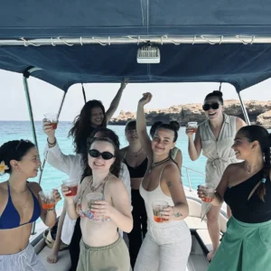 Group of girls dancing in the boat