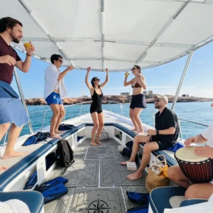 group of friends dancing in the boat
